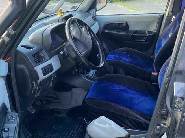 Чорний Міцубісі Паджеро, об'ємом двигуна 1 л та пробігом 2 тис. км за 2050 $, фото 4 на Automoto.ua