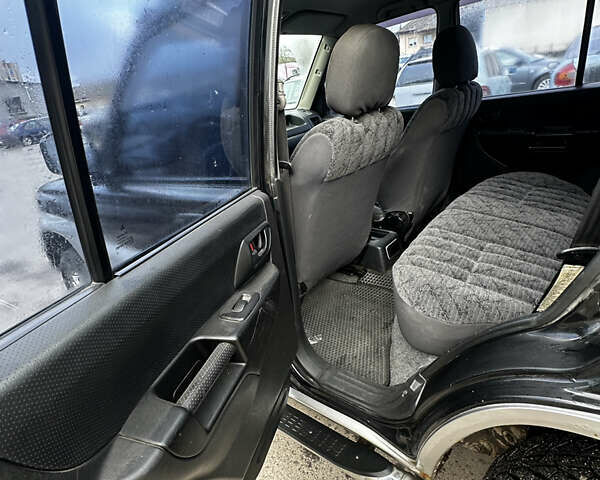 Чорний Міцубісі Паджеро, об'ємом двигуна 1.83 л та пробігом 229 тис. км за 4950 $, фото 11 на Automoto.ua