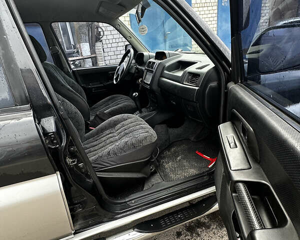 Чорний Міцубісі Паджеро, об'ємом двигуна 1.83 л та пробігом 229 тис. км за 4950 $, фото 10 на Automoto.ua