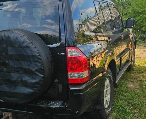 Чорний Міцубісі Паджеро, об'ємом двигуна 3 л та пробігом 315 тис. км за 7850 $, фото 3 на Automoto.ua