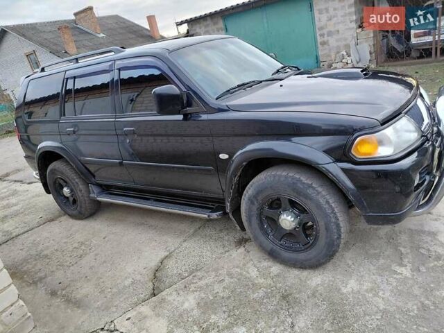 Черный Мицубиси Паджеро, объемом двигателя 2.48 л и пробегом 235 тыс. км за 12000 $, фото 6 на Automoto.ua
