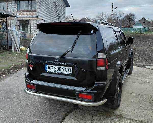 Черный Мицубиси Паджеро, объемом двигателя 2.48 л и пробегом 235 тыс. км за 12000 $, фото 1 на Automoto.ua