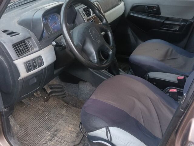 Коричневый Мицубиси Паджеро, объемом двигателя 1 л и пробегом 165 тыс. км за 2500 $, фото 5 на Automoto.ua