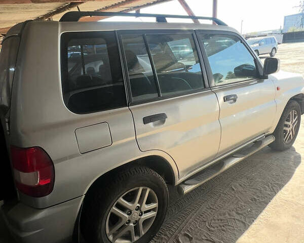 Серый Мицубиси Паджеро, объемом двигателя 1.8 л и пробегом 115 тыс. км за 6000 $, фото 12 на Automoto.ua