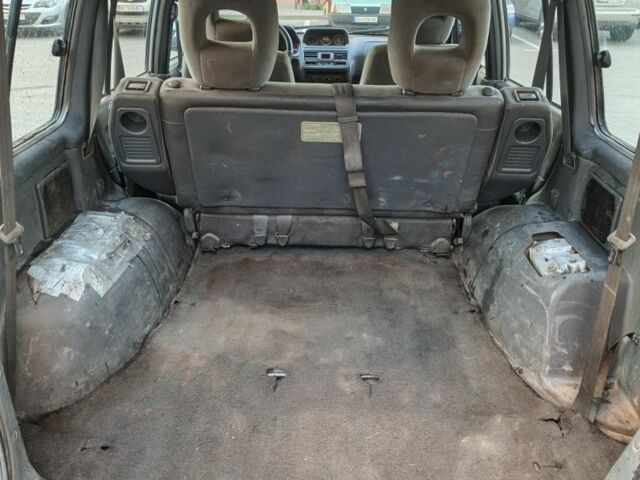 Серый Мицубиси Паджеро, объемом двигателя 3 л и пробегом 389 тыс. км за 3750 $, фото 4 на Automoto.ua