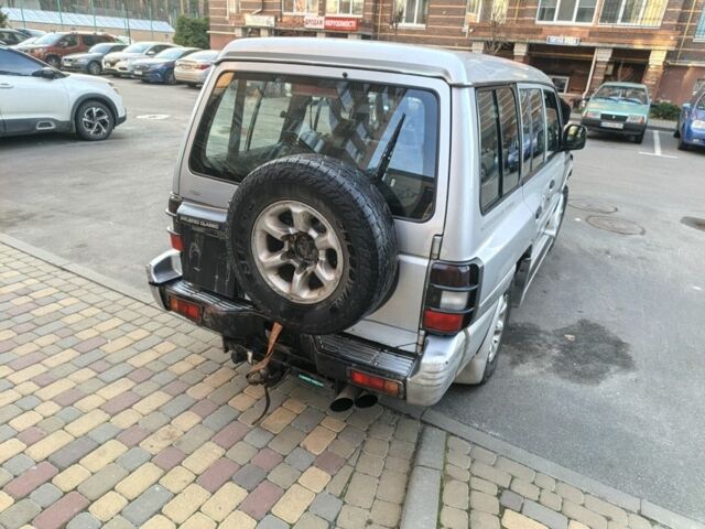 Серый Мицубиси Паджеро, объемом двигателя 3 л и пробегом 389 тыс. км за 3750 $, фото 2 на Automoto.ua