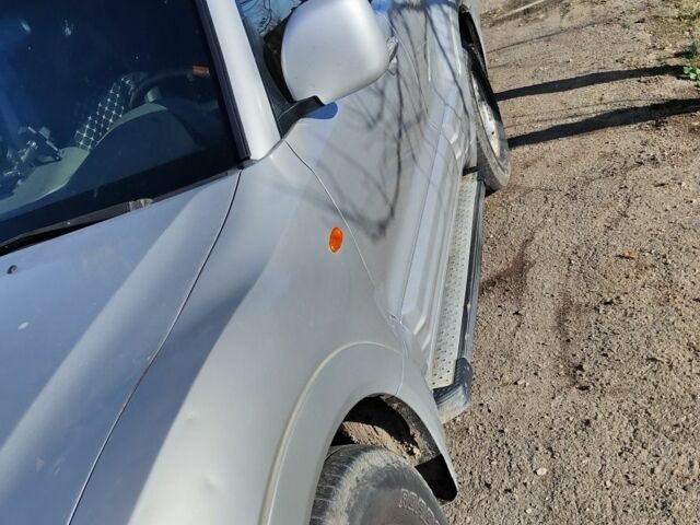 Серый Мицубиси Паджеро, объемом двигателя 3 л и пробегом 325 тыс. км за 4500 $, фото 2 на Automoto.ua