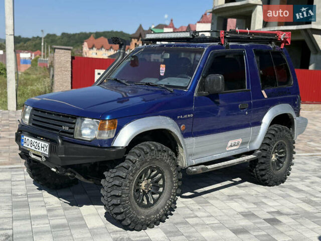 Синий Мицубиси Паджеро, объемом двигателя 3 л и пробегом 230 тыс. км за 10500 $, фото 1 на Automoto.ua