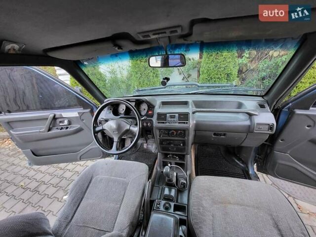 Синий Мицубиси Паджеро, объемом двигателя 2.48 л и пробегом 100 тыс. км за 6000 $, фото 1 на Automoto.ua