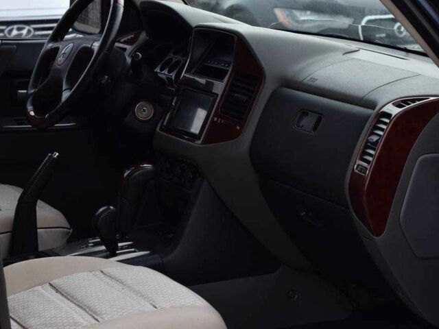 Синій Міцубісі Паджеро, об'ємом двигуна 3 л та пробігом 220 тис. км за 8450 $, фото 12 на Automoto.ua