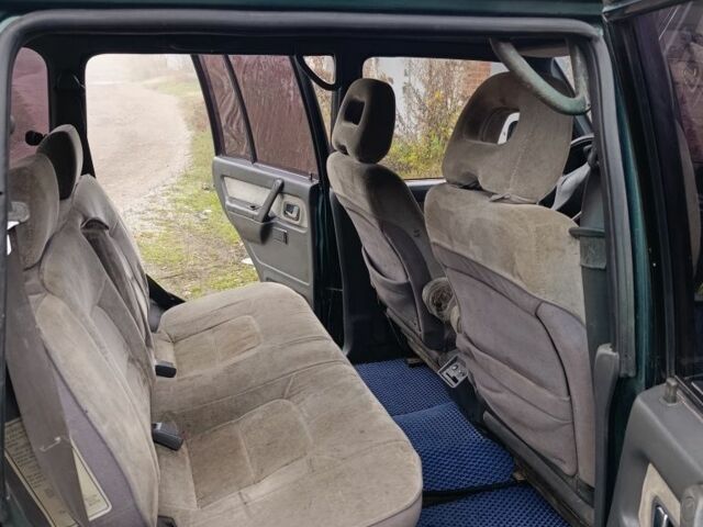 Зеленый Мицубиси Паджеро, объемом двигателя 2.5 л и пробегом 403 тыс. км за 5000 $, фото 5 на Automoto.ua