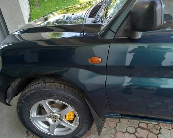 Зелений Міцубісі Паджеро, об'ємом двигуна 1.8 л та пробігом 205 тис. км за 5800 $, фото 16 на Automoto.ua