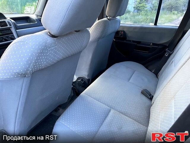 Зеленый Мицубиси Паджеро, объемом двигателя 1.8 л и пробегом 310 тыс. км за 5500 $, фото 9 на Automoto.ua