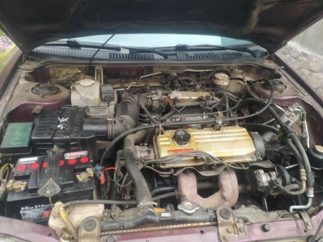 Красный Мицубиси Протон, объемом двигателя 1.3 л и пробегом 290 тыс. км за 1200 $, фото 3 на Automoto.ua