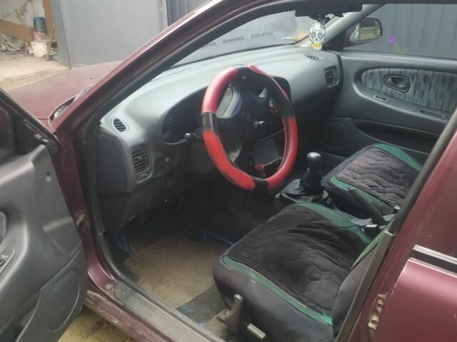 Красный Мицубиси Протон, объемом двигателя 1.3 л и пробегом 290 тыс. км за 1200 $, фото 2 на Automoto.ua