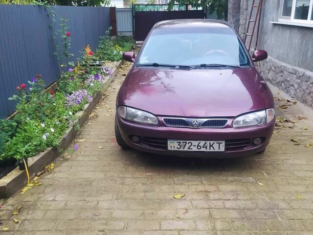 Красный Мицубиси Протон, объемом двигателя 1.3 л и пробегом 290 тыс. км за 1200 $, фото 4 на Automoto.ua