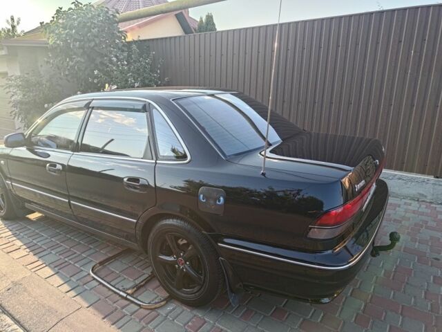 Черный Мицубиси Сигма, объемом двигателя 3 л и пробегом 250 тыс. км за 3452 $, фото 1 на Automoto.ua