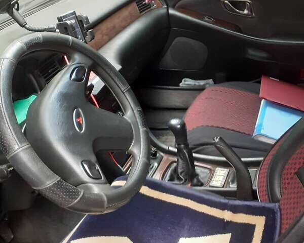 Красный Мицубиси Сигма, объемом двигателя 3 л и пробегом 100 тыс. км за 2000 $, фото 7 на Automoto.ua