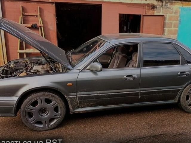 Серый Мицубиси Сигма, объемом двигателя 3 л и пробегом 370 тыс. км за 1546 $, фото 3 на Automoto.ua