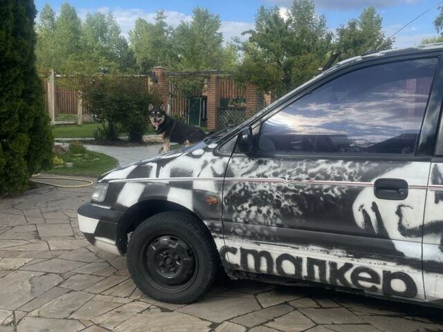 Белый Мицубиси Спейс Раннер, объемом двигателя 1.8 л и пробегом 377 тыс. км за 2000 $, фото 2 на Automoto.ua