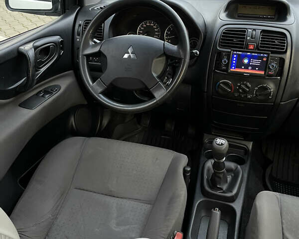 Білий Міцубісі Спейс Стар, об'ємом двигуна 1.58 л та пробігом 319 тис. км за 3500 $, фото 15 на Automoto.ua