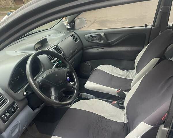 Черный Мицубиси Спейс Стар, объемом двигателя 1.3 л и пробегом 300 тыс. км за 2500 $, фото 4 на Automoto.ua