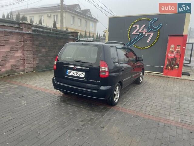 Черный Мицубиси Спейс Стар, объемом двигателя 1.3 л и пробегом 300 тыс. км за 2500 $, фото 3 на Automoto.ua