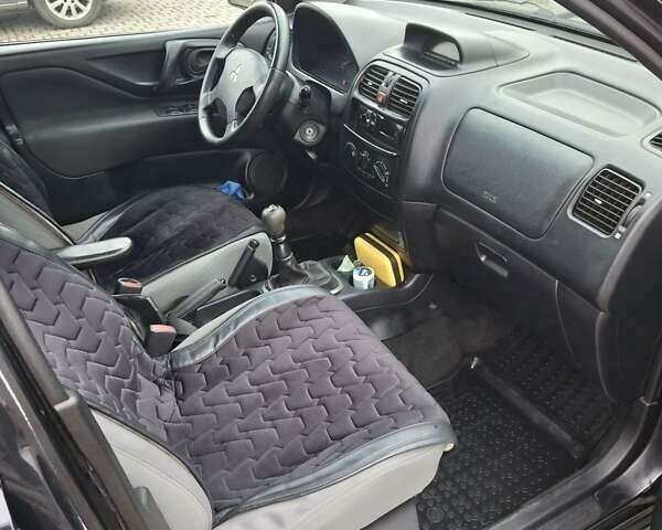 Черный Мицубиси Спейс Стар, объемом двигателя 1.58 л и пробегом 478 тыс. км за 2600 $, фото 5 на Automoto.ua