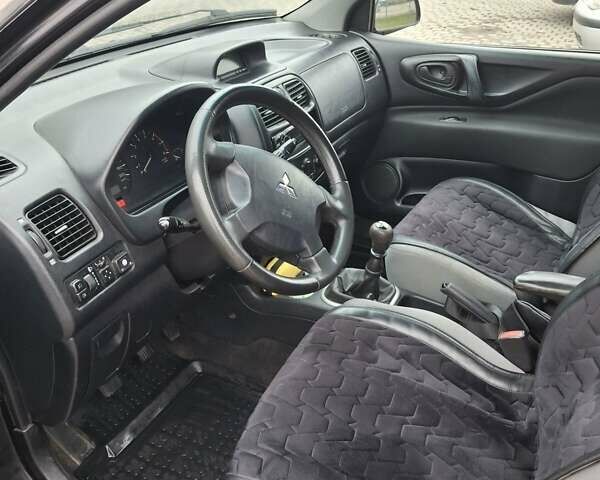 Черный Мицубиси Спейс Стар, объемом двигателя 1.58 л и пробегом 478 тыс. км за 2600 $, фото 1 на Automoto.ua