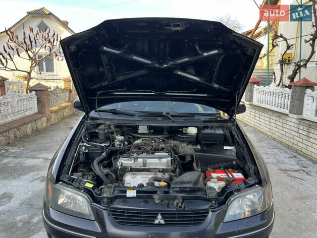 Чорний Міцубісі Спейс Стар, об'ємом двигуна 1.6 л та пробігом 300 тис. км за 2750 $, фото 49 на Automoto.ua