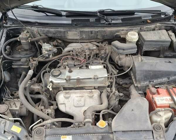 Черный Мицубиси Спейс Стар, объемом двигателя 1.58 л и пробегом 478 тыс. км за 2600 $, фото 11 на Automoto.ua