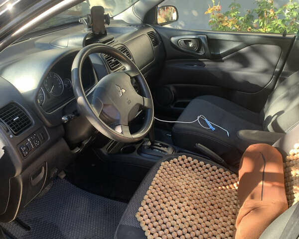 Міцубісі Спейс Стар 2004 у Одесі на Automoto.ua Чорний Міцубісі Спейс Стар, об'ємом двигуна 1.58 л та пробігом 242 тис. км за 3500 $, фото 12 на Automoto.ua
