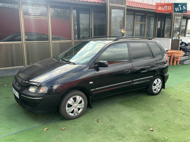 Черный Мицубиси Спейс Стар, объемом двигателя 1.83 л и пробегом 190 тыс. км за 2800 $, фото 4 на Automoto.ua