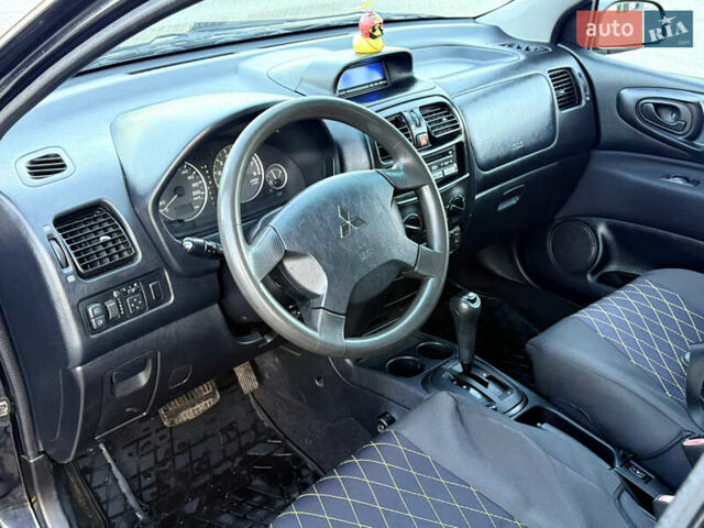 Черный Мицубиси Спейс Стар, объемом двигателя 1.83 л и пробегом 190 тыс. км за 2800 $, фото 10 на Automoto.ua