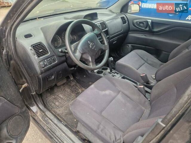 Черный Мицубиси Спейс Стар, объемом двигателя 1.8 л и пробегом 250 тыс. км за 1900 $, фото 1 на Automoto.ua