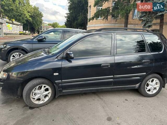 Черный Мицубиси Спейс Стар, объемом двигателя 1.8 л и пробегом 170 тыс. км за 3500 $, фото 2 на Automoto.ua
