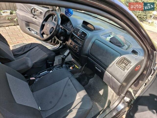 Чорний Міцубісі Спейс Стар, об'ємом двигуна 1.6 л та пробігом 240 тис. км за 5000 $, фото 6 на Automoto.ua