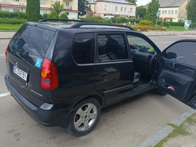 Черный Мицубиси Спейс Стар, объемом двигателя 1.6 л и пробегом 210 тыс. км за 2000 $, фото 5 на Automoto.ua