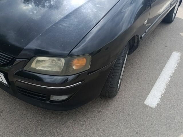 Черный Мицубиси Спейс Стар, объемом двигателя 1.6 л и пробегом 210 тыс. км за 2000 $, фото 1 на Automoto.ua