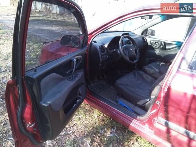 Красный Мицубиси Спейс Стар, объемом двигателя 1.58 л и пробегом 350 тыс. км за 3550 $, фото 12 на Automoto.ua