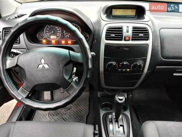 Красный Мицубиси Спейс Стар, объемом двигателя 1.83 л и пробегом 295 тыс. км за 3500 $, фото 8 на Automoto.ua