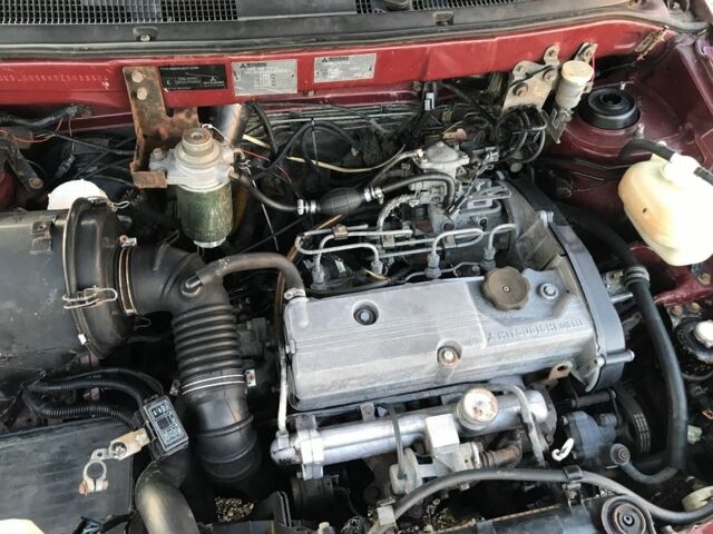 Красный Мицубиси Спейс Стар, объемом двигателя 2 л и пробегом 400 тыс. км за 900 $, фото 8 на Automoto.ua