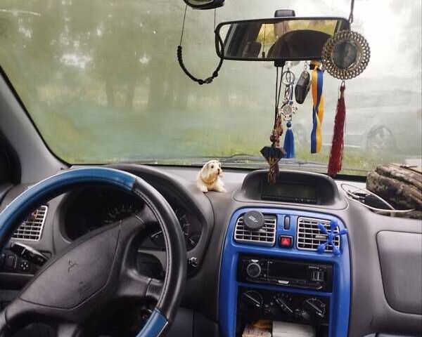 Серый Мицубиси Спейс Стар, объемом двигателя 1.3 л и пробегом 196 тыс. км за 2500 $, фото 7 на Automoto.ua