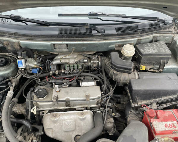 Сірий Міцубісі Спейс Стар, об'ємом двигуна 1.58 л та пробігом 295 тис. км за 2750 $, фото 16 на Automoto.ua