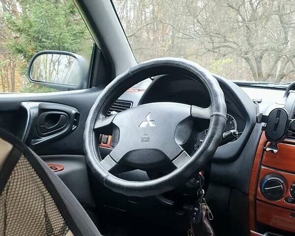 Сірий Міцубісі Спейс Стар, об'ємом двигуна 1.6 л та пробігом 208 тис. км за 3550 $, фото 14 на Automoto.ua
