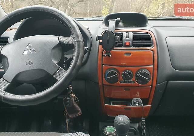 Сірий Міцубісі Спейс Стар, об'ємом двигуна 1.6 л та пробігом 208 тис. км за 3550 $, фото 21 на Automoto.ua