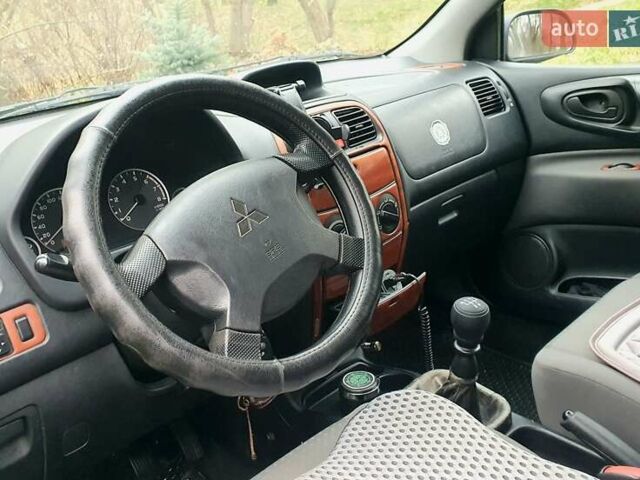 Сірий Міцубісі Спейс Стар, об'ємом двигуна 1.6 л та пробігом 208 тис. км за 3550 $, фото 19 на Automoto.ua