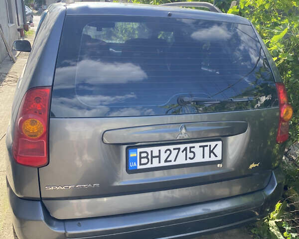Серый Мицубиси Спейс Стар, объемом двигателя 1.58 л и пробегом 240 тыс. км за 3800 $, фото 1 на Automoto.ua