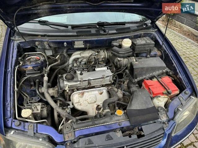 Синий Мицубиси Спейс Стар, объемом двигателя 1.58 л и пробегом 381 тыс. км за 2600 $, фото 8 на Automoto.ua