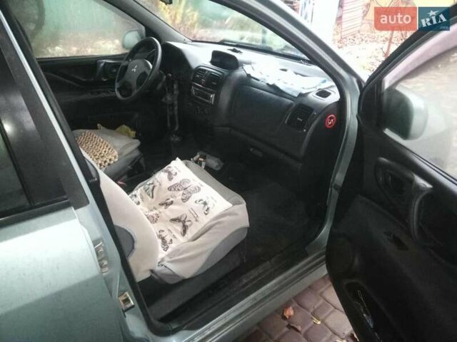 Синий Мицубиси Спейс Стар, объемом двигателя 1.6 л и пробегом 226 тыс. км за 2100 $, фото 6 на Automoto.ua